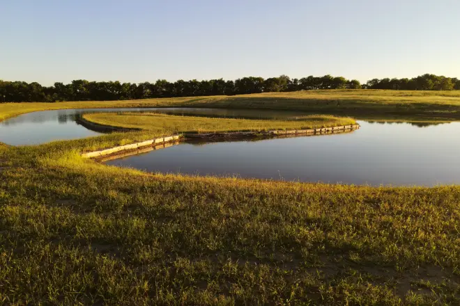a pond with a peninsula installation