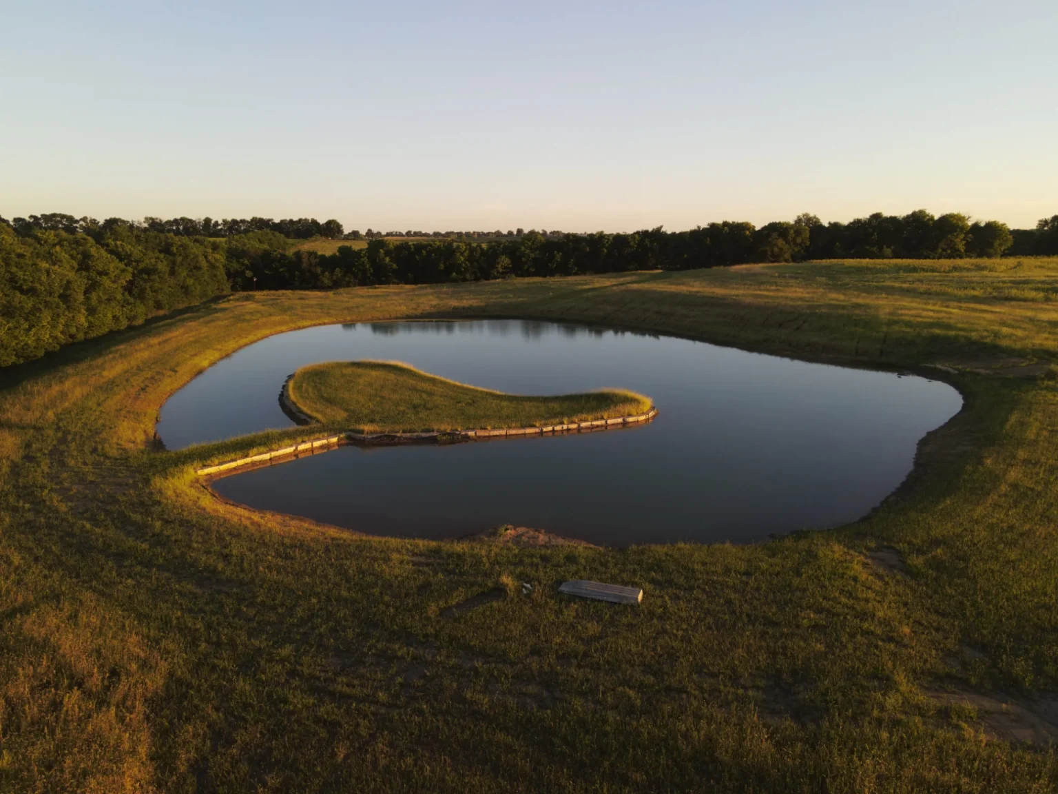 3-Acre Pond with a Peninsula in Gardner, Johnson County, KS by Bulletproof Pond and Lake
