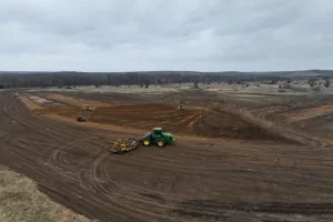 professional pond excavation uses scraper systems