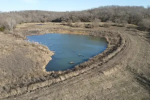 A pond in the process of filling up with natural water sources