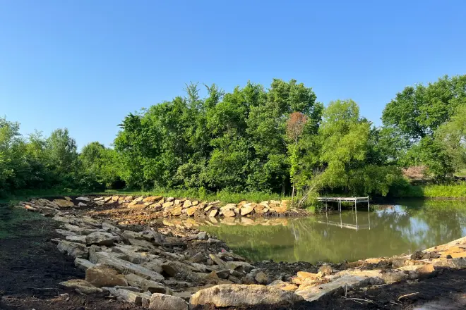 A pond that was expanded by a professional pond contractor.