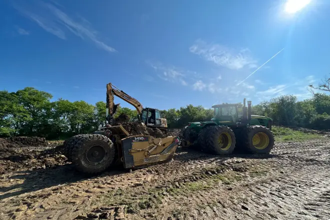 A scraper system used for professional pond excavation - Bulletproof Pond and Lake A scraper system used for professional pond excavation