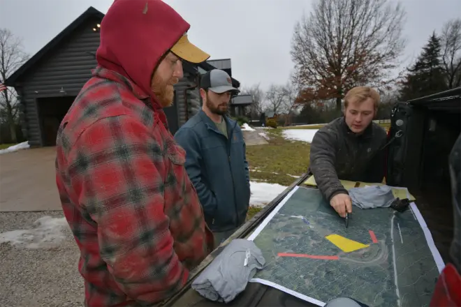 Bulletproof Pond and Lake workers and pond contractor  looking and pond construction plans