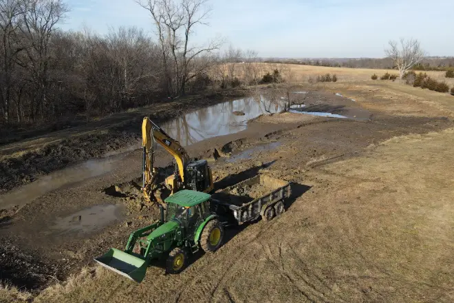 The Bulletproof Pond and Lake team dredging a pond - Bulletproof Pond and Lake The Bulletproof Pond and Lake team dredging a pond
