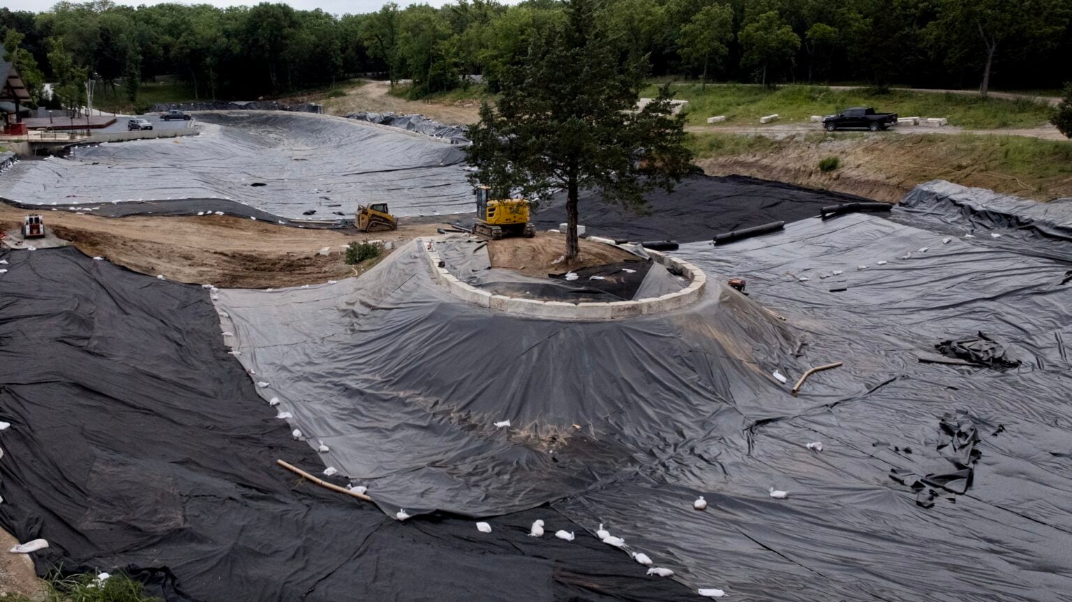 Geosynthetic plastic-lined pond installed by Bulletproof Pond and Lake at a luxury waterfront resort in Olathe, Kansas