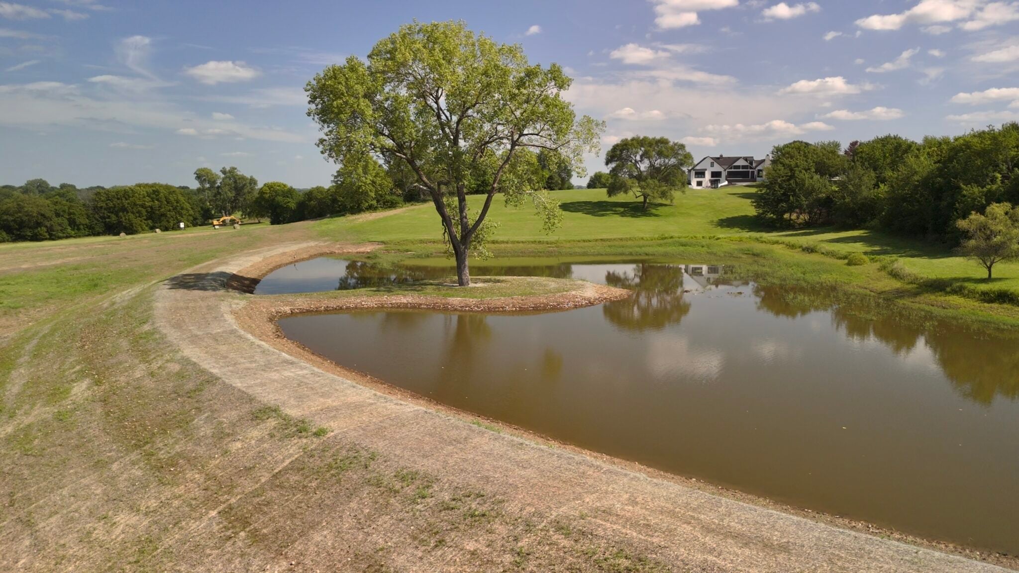 Pond Expansion with peninsula and tree, in Kansas Designed and built by Bulletproof Pond and Lake