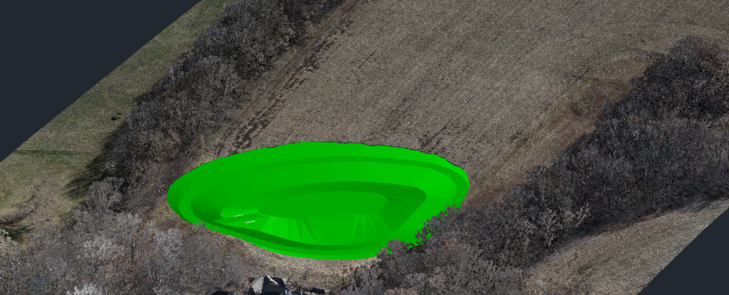 AutoCAD Lake Design by Bulletproof Pond and Lake - Bulletproof Pond and Lake Neon green circular ring-shaped structure with tiered interior in a grassy field (aerial view).