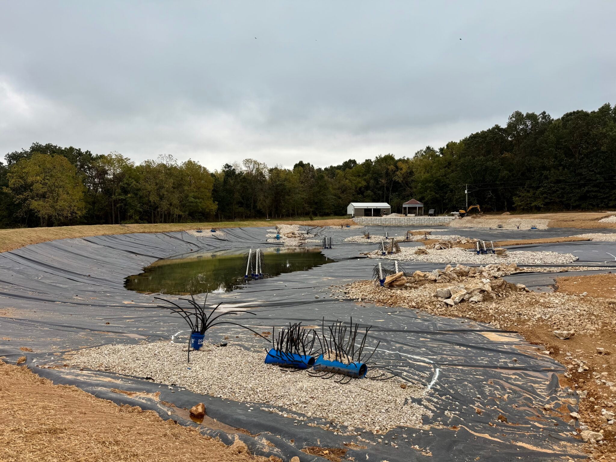 Fish structure in a lined pond by Bulletproof Pond and Lake, with fish habitat and varied depths built into the pond design